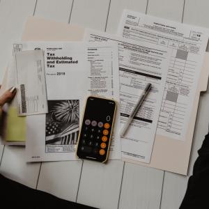 Photo by <a href="https://unsplash.com/@kellysikkema?utm_source=unsplash&utm_medium=referral&utm_content=creditCopyText">Kelly Sikkema</a> on <a href="https://unsplash.com/s/photos/taxes?utm_source=unsplash&utm_medium=referral&utm_content=creditCopyText">Unsplash</a> Tributi